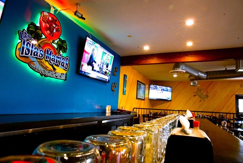 Colorful restaurant interior with family seating.