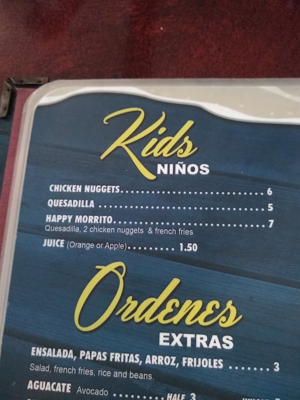 Printed menu showing aguas frescas and beer.